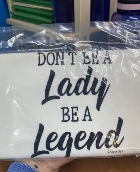 tea towel with don't be a lady be a legend quote